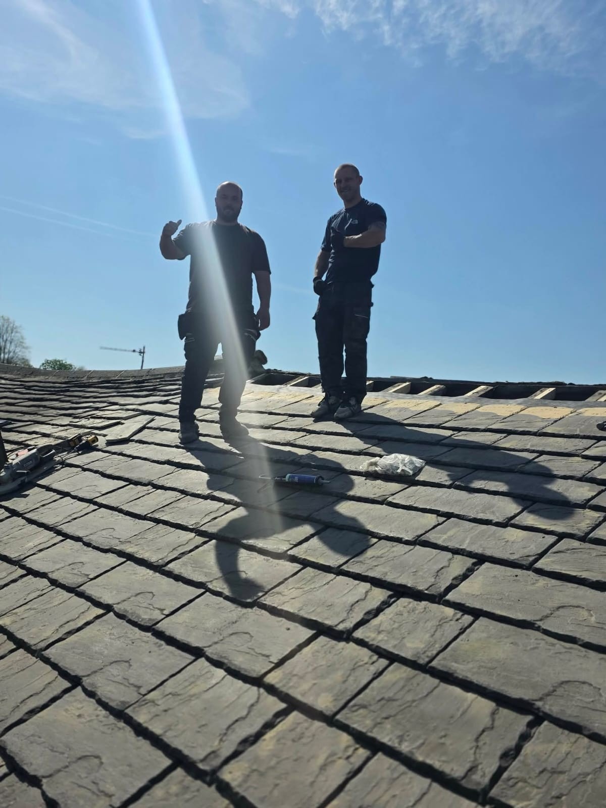 Peak Performance roofers working on a stripped stone slate roof in Yorkshire