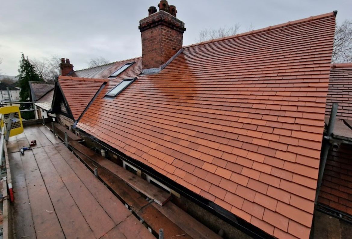 Finished re-roof with new tiles, ridge and verge details