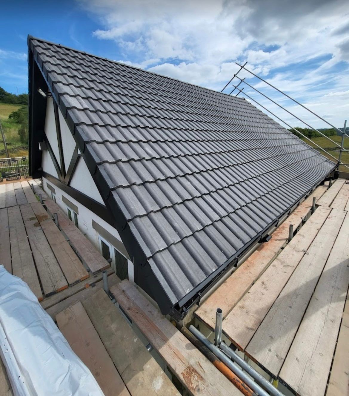 New dark grey interlocking tiled roof on a detached Yorkshire house