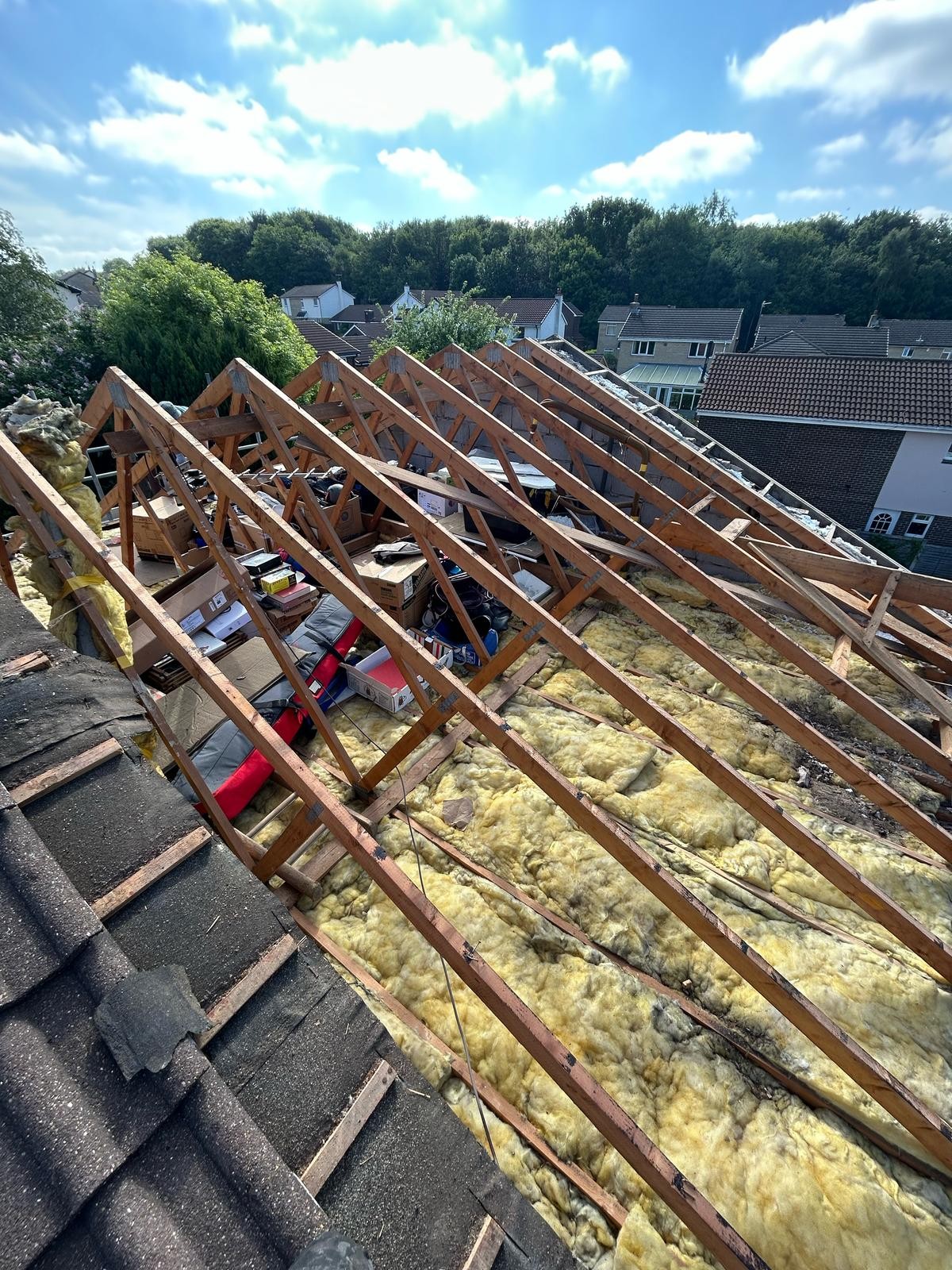 Bare roof timbers exposed before new membrane and battens