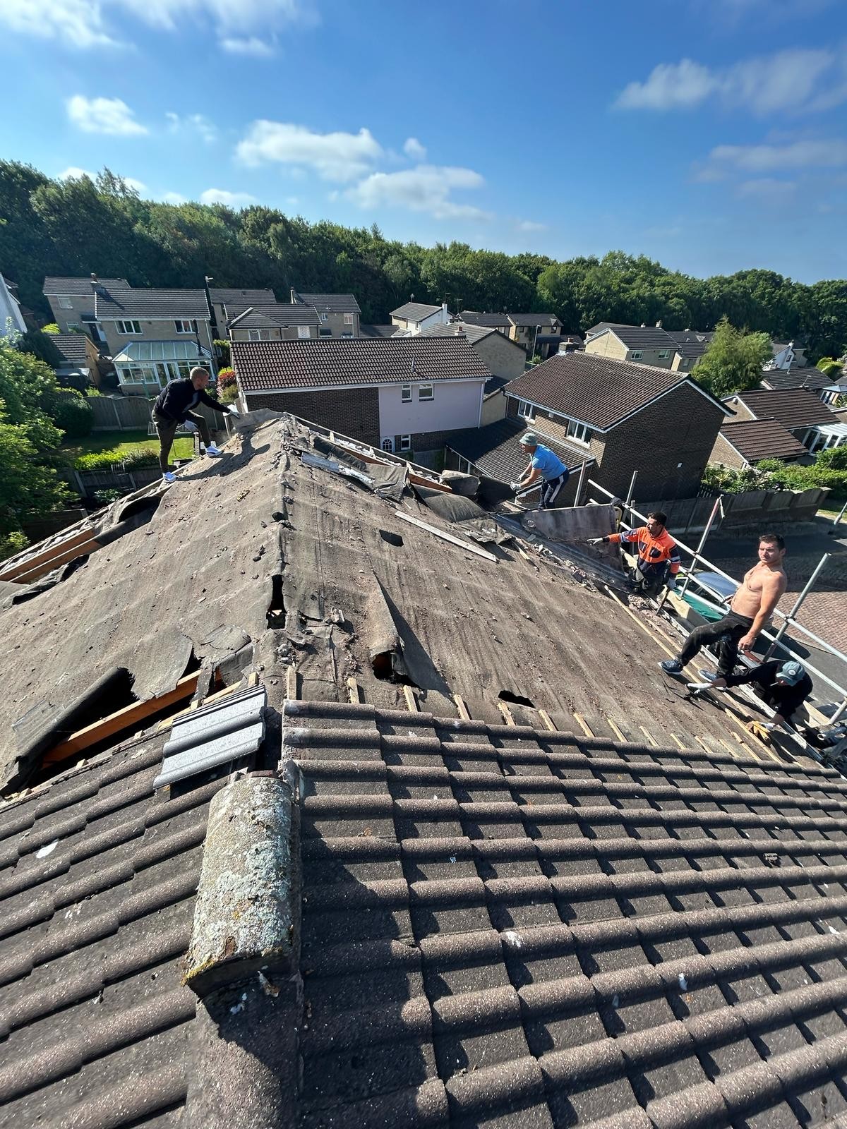 Worn roof slope photographed before re-tiling works begin