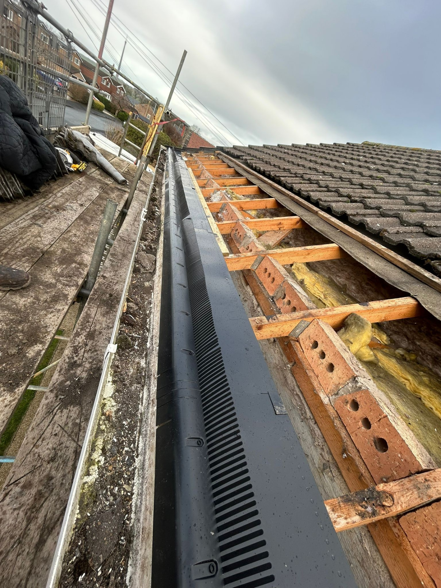 Eaves detail with new felt support tray and treated battens during a pitched re-roof