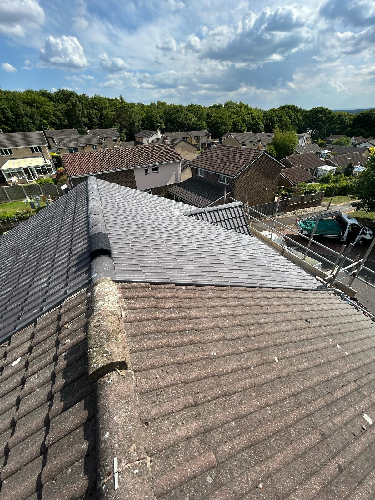 Newly tiled pitched roof with fresh ridge line on a Yorkshire home